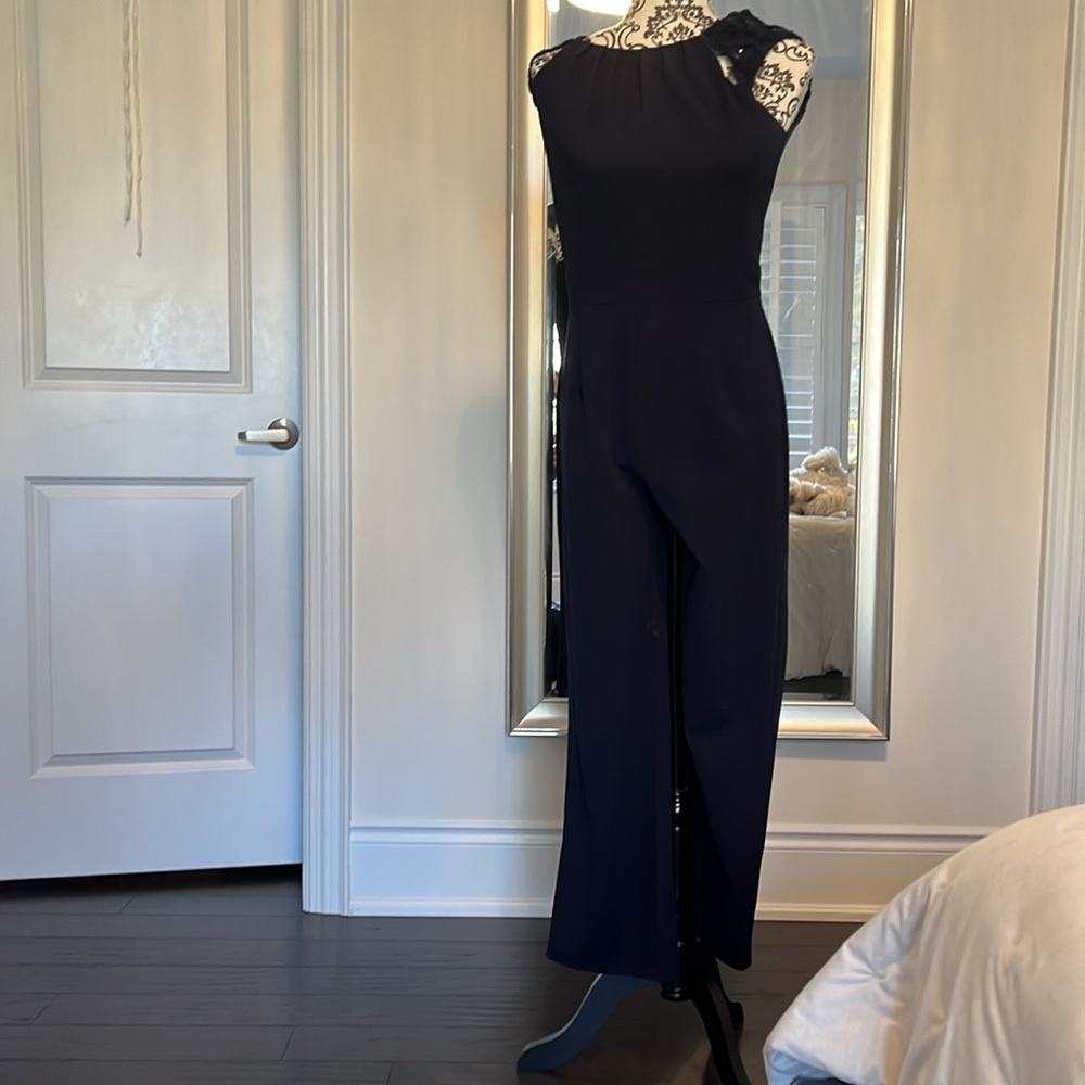 Blue jumpsuit can be worn at office with a blazer or an evening out.